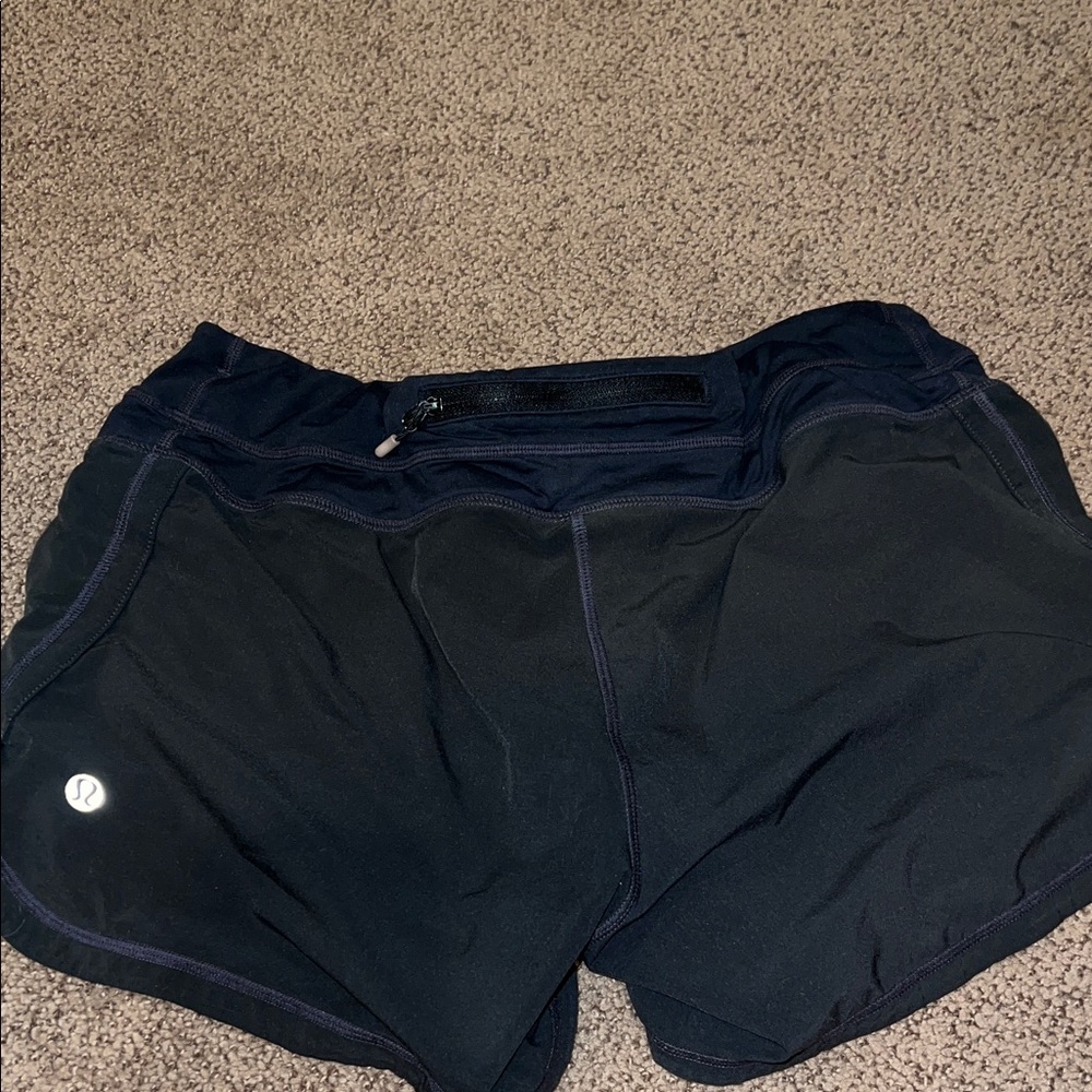 Lululemon size 8 black shirts 4” back zipper pocket